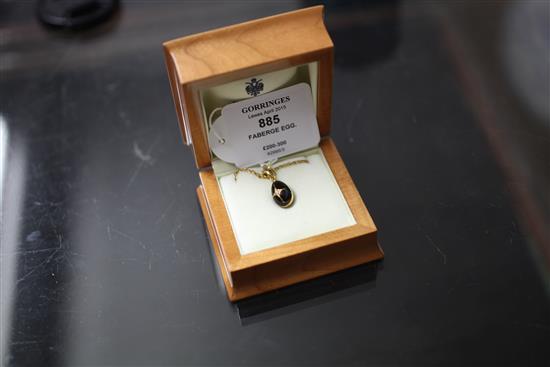 A Victor Mayer for Faberge 18ct gold, black onyx and diamond set egg pendant on 9ct gold chain,